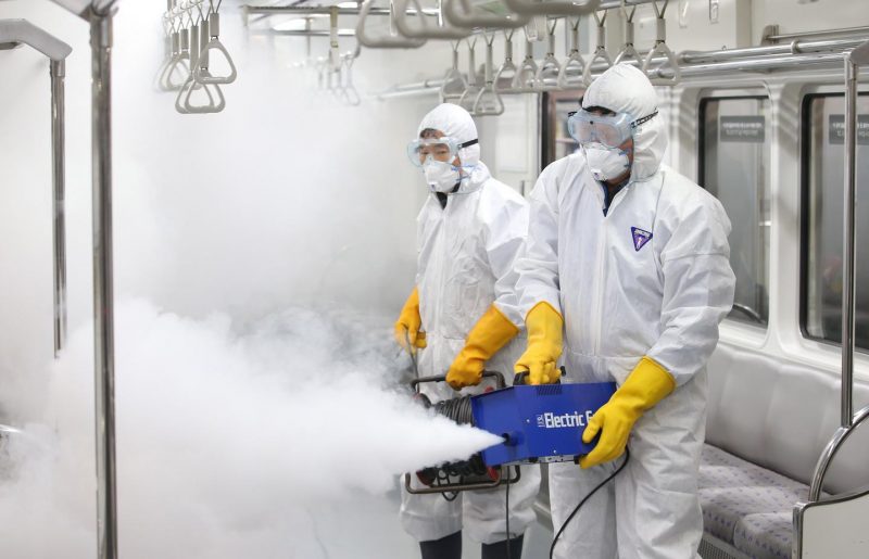 epa05165560 Workers fumigate a train car at a train depot in Seoul's Gangseo Ward, South Korea, 17 February 2016, as a precaution against the spread of the Zika virus (ZIKV). The Centers for Disease Control and Prevention said the same day that the government will launch a nationwide mosquito control program to prevent the import of the mosquito-borne virus. The control efforts will target the Asian tiger mosquito, said to spread the virus that causes microcephaly in unborn children. EPA/YONHAP SOUTH KOREA OUT